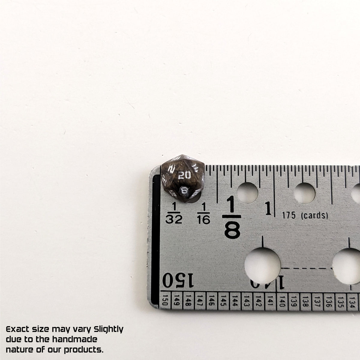 A size graphic of the d20 stud. The stud is brown with white numbers and centers the 20 face next to a ruler on a white background. The ruler shows the width of the stud as 10 mm or 0.39 in. The lower lefthand corner has a disclaimer that reads, "Exact size may vary slightly due to the handmade nature of our products."