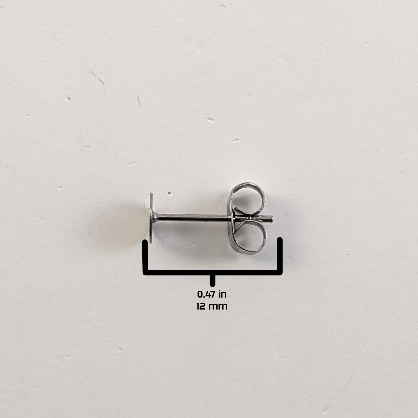 A size graphic of the earring post and butterfly back on a white background. It shows the length of the post as 12 mm or 0.47 in.