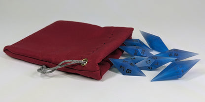 Electric blue swirls with grey numbering diamond handmade dice spilling out of a red drawstring bag on a white background. The set features 2 d20s and matching resin dice, showcasing the unique shape of these artisan dice.