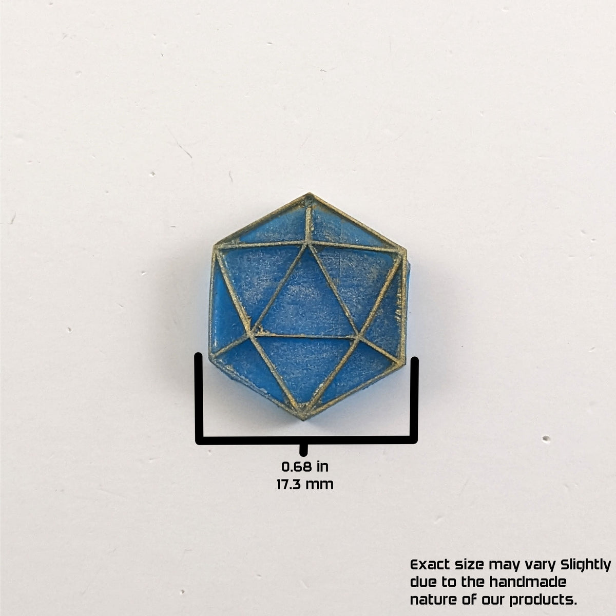A graphic showing a blue and gold flat dangly d20 earring without a number or hardware on a white background. The graphic overlay shows the width of the d20 dangle as 0.68 inches or 17.33 mm. The bottom right corner has a disclaimer that reads, "Exact size may vary slightly due to the handmade nature of our products."