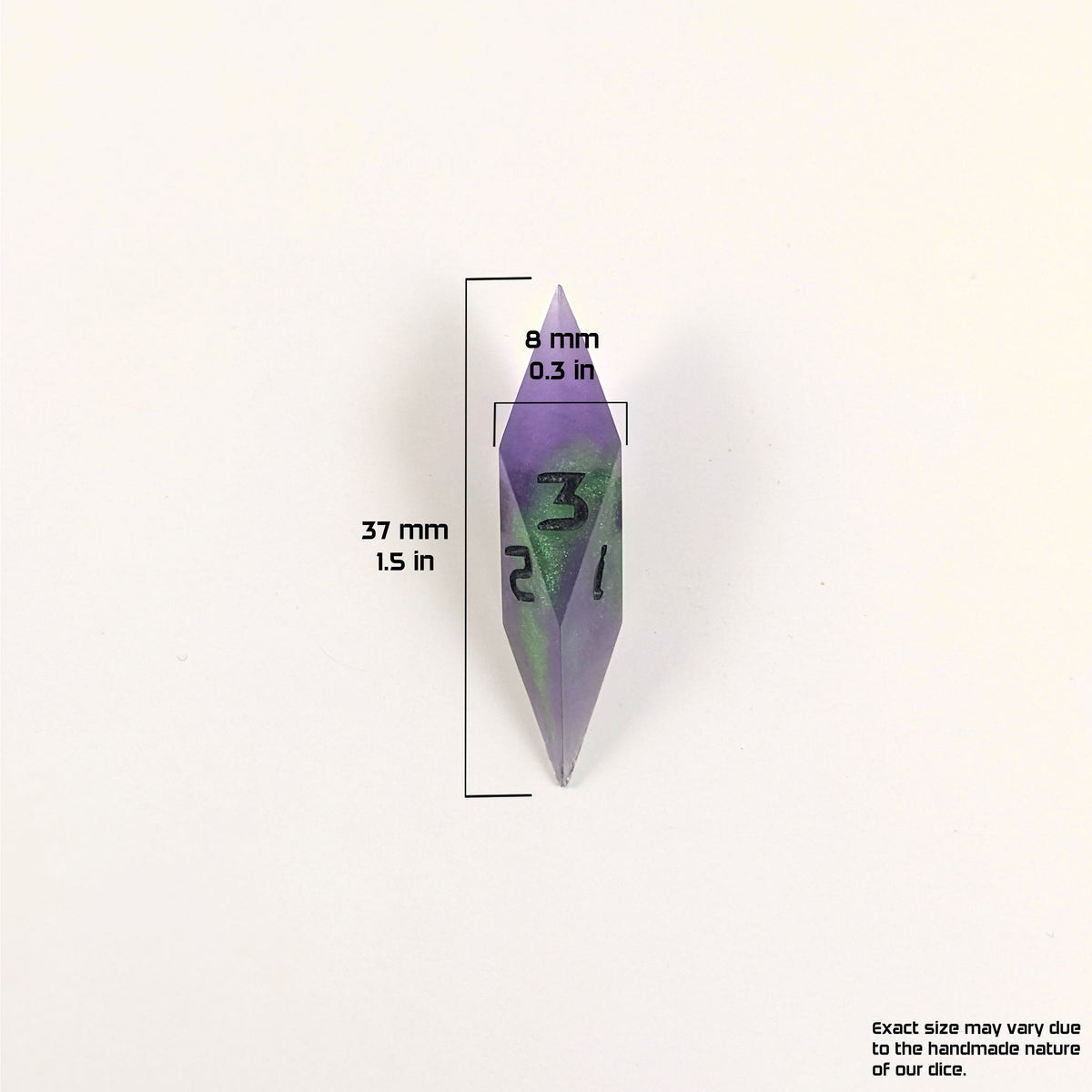 A size graphic of a diamond d3. The die is purple and green with black numbers. The die is 37 mm 1.5 in tall and 8 mm 0.3 in wide. The bottom right corner notes "Exact size may vary due to the handmade nature of our dice."