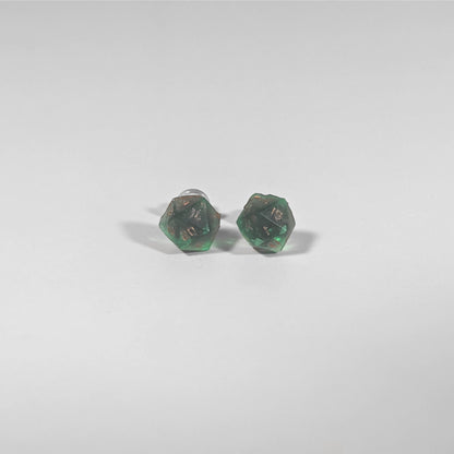 A single pair of the smaller size handmade d20 earrings with titanium hardware that are emerald green with copper numbers on a white background. The earring on the left centers the 20 face and the earring on the right centers the 1 face.
