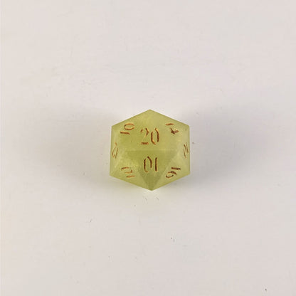 A top down photo of a reliable talent d20 on a white background. The die is light green with gold numbers. Faces that would be 9 or below are replaced with a 10.