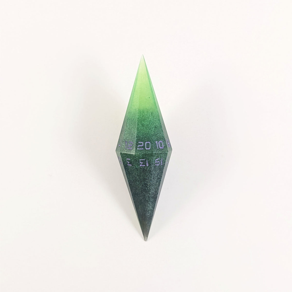 A high angle view of a diamond d20 with swirls of black and green with purple numbers that glow in the dark on a white background.