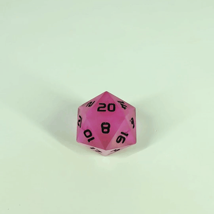 A high angle gif of a standard d20 with pink/purple swirls and black numbers with the 20 face up on a white background. The image shifts from regular light to darkness, where the die starts to glow green.