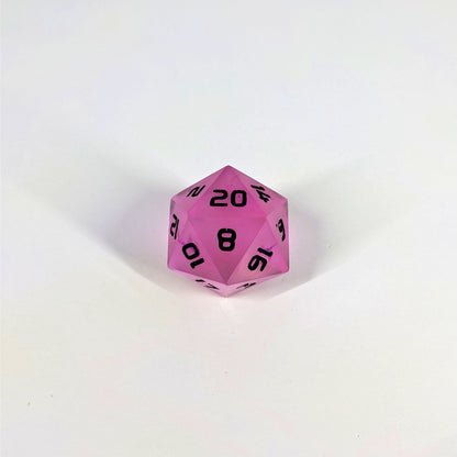 A high angle photo of a standard d20 with pink/purple swirls and black numbers with the 20 face up on a white background.