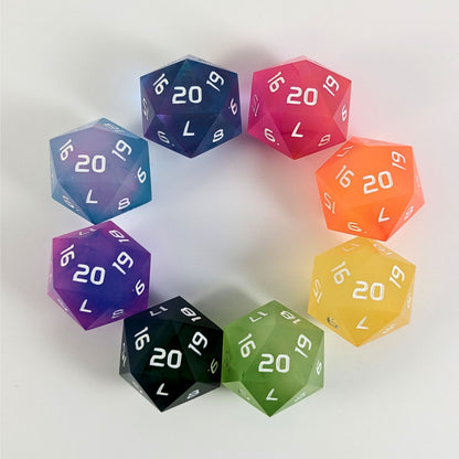 Eight brightly colored spindown d20s with a right spin arranged in a circle on a white background. The top right d20 is magenta, and following clockwise is orange, yellow, yellow green, blue and green, pink and blue, opaque pink and teal, and clear pink and teal.
