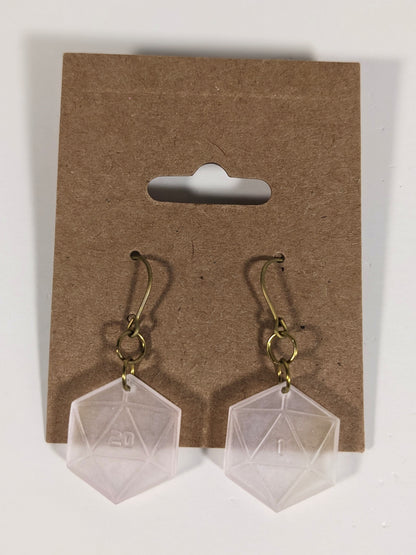 A pair of pale pink and white dangly, flat d20 earrings with gold color titanium and niobium hardware on a kraft earring card on a white background. The earring on the left has a 20 on it and the earring on the right has a 1 on it, both in a sci-fi style font.