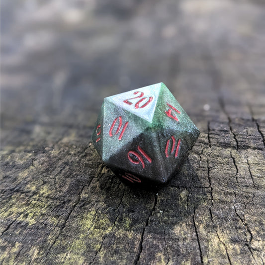 A close up photo of a dark green and black reliable talent d20 with red numbers sitting on a wood stump. Faces that would be 9 or below are replaced with a 10.