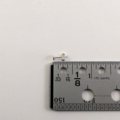 A size graphic of a sterling silver earring post and butterfly back next to a ruler and on a white background. It shows the length of the post as 9.5 mm or 0.37 in.