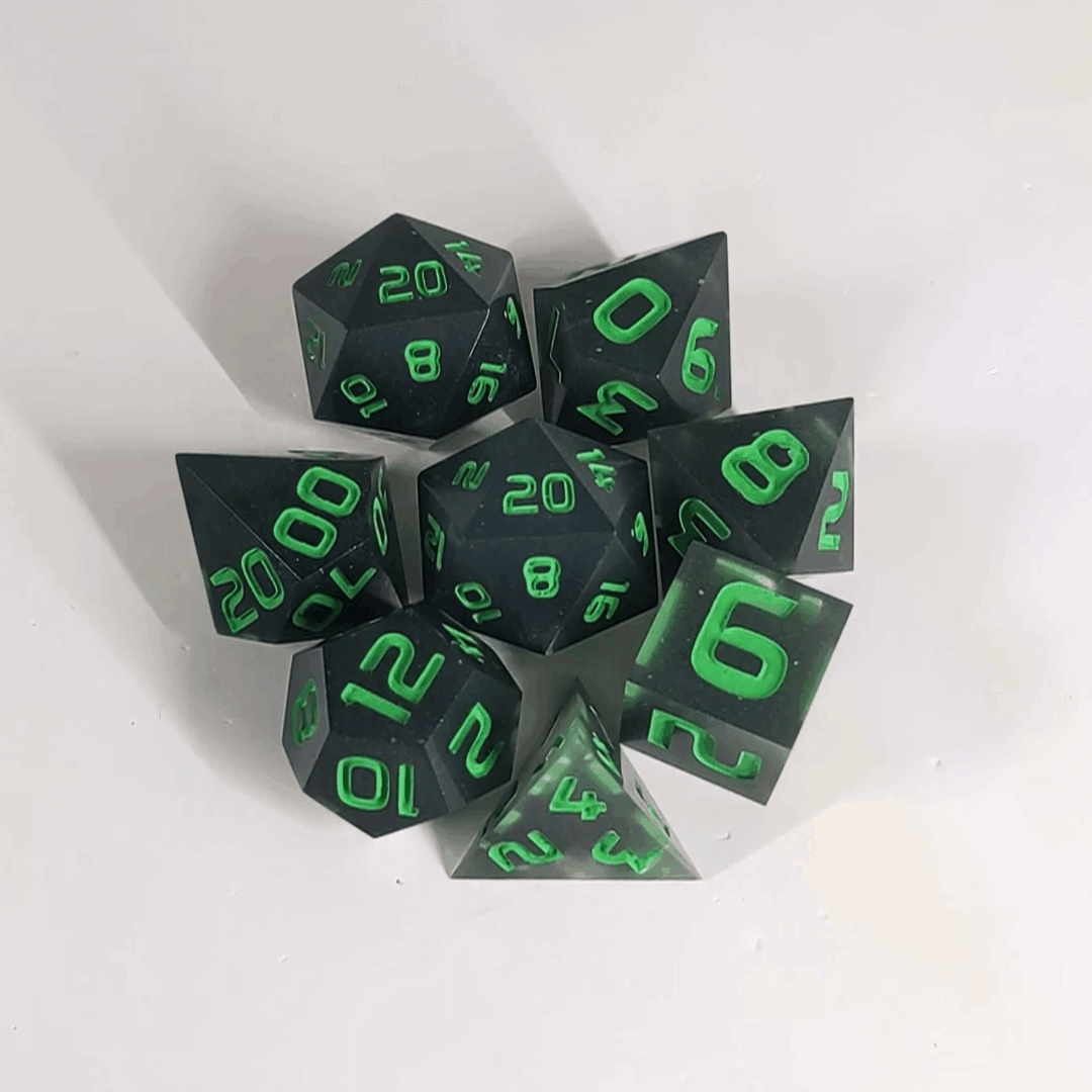 A gif showing a polyhedral dnd dice set in a circle with a d20 in the middle surrounded by the other 7 dice. The dice are black with some semitranslucent swirls and bright green numbers. The gif transitions from light to darkness and the dice shift from their normal color to glowing green in the dark.