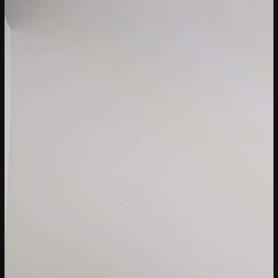 A video of the set of dagger shaped dnd dice that are orange and purple with black numbers rolling two at a time. First the two d20s are rolled and land near the top of the frame, then the d% and d10, then the d6 and d4 which lands poking partly out of frame, and finally the d8 and d12.