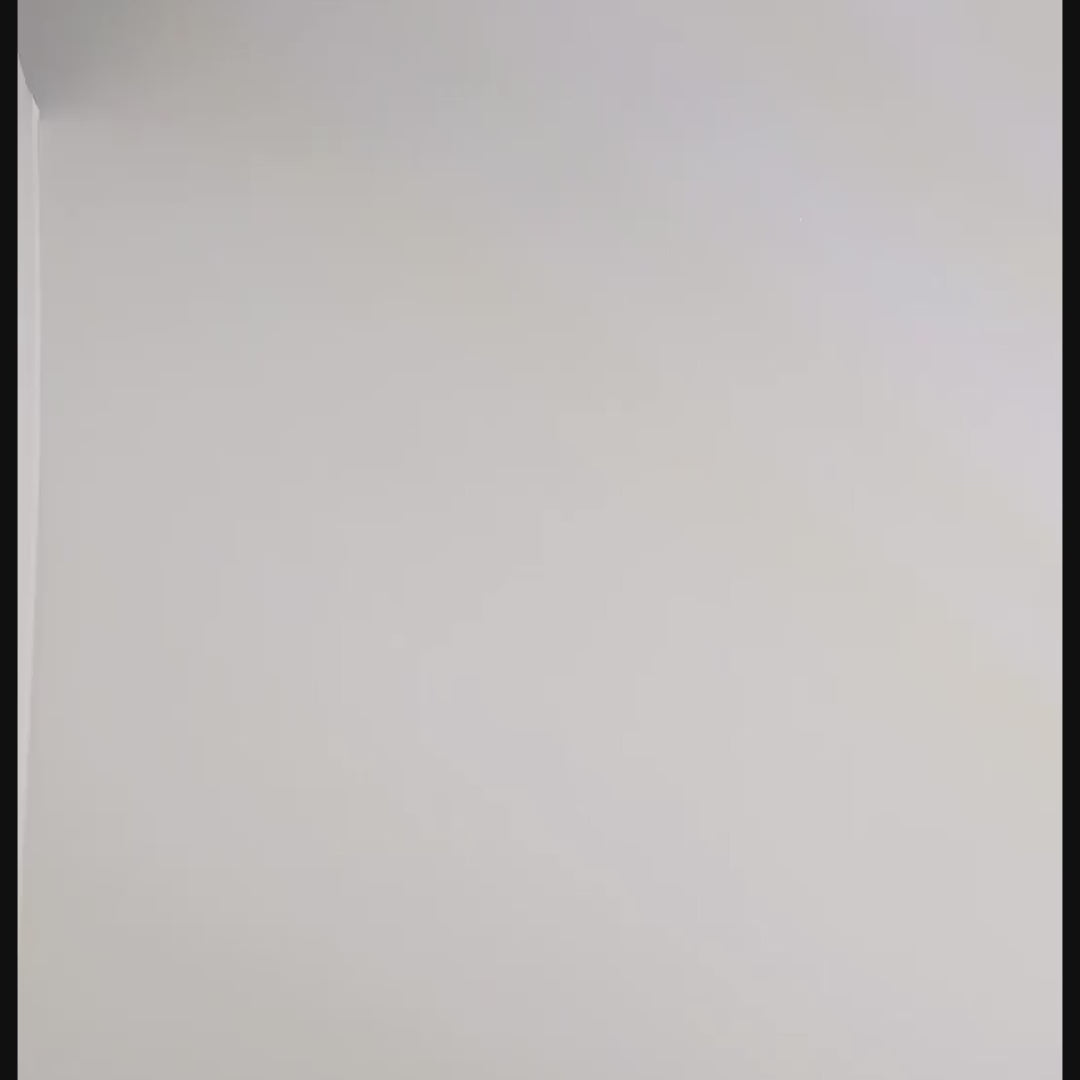 A video of the set of dagger shaped dnd dice that are orange and purple with black numbers rolling two at a time. First the two d20s are rolled and land near the top of the frame, then the d% and d10, then the d6 and d4 which lands poking partly out of frame, and finally the d8 and d12.