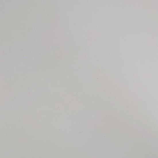 A large d20 that has swirls of orange, yellow, and a small amount of red with dark red numbers is rolled coming in from the bottom of the frame, and lands on a 1.