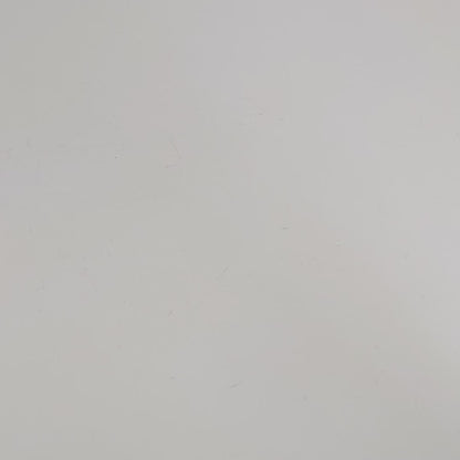 A large d20 that has swirls of orange, yellow, and a small amount of red with dark red numbers is rolled coming in from the bottom of the frame, and lands on a 1.
